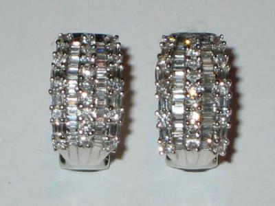 Appraisal: A PAIR OF DIAMOND EARRINGS modelled as curved oblong panels