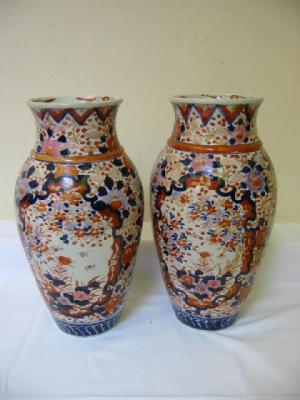 Appraisal: A PAIR OF IMARI PORCELAIN VASES of baluster form painted