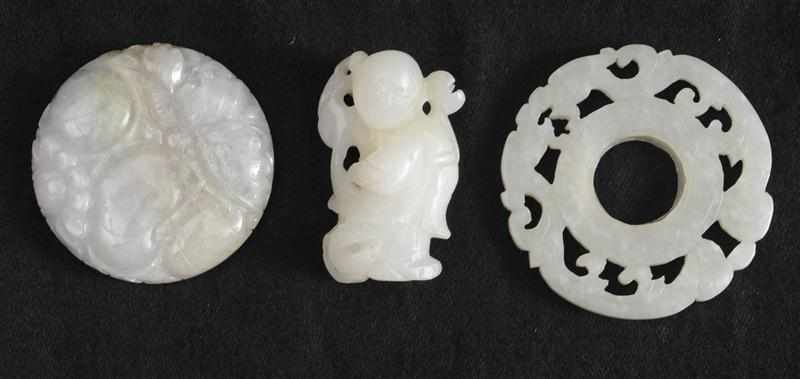 Appraisal: TWO CHINESE CARVED PALE CELADON JADE PENDANTS AND A CARVED