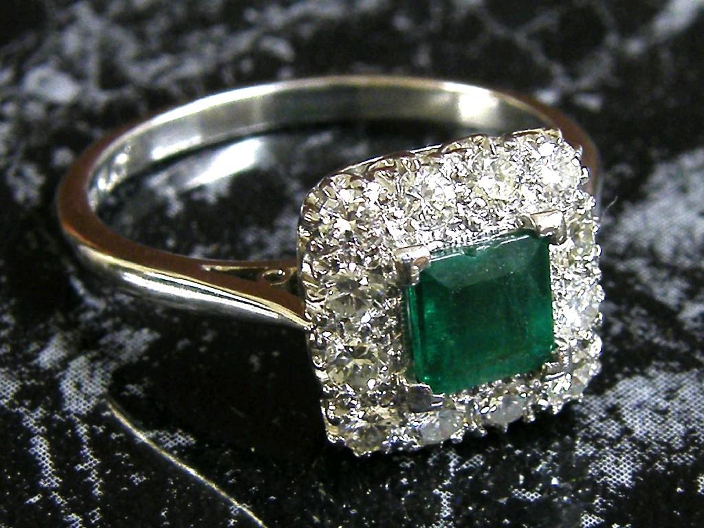 Appraisal: Good emerald and brilliant cut diamond square cluster ring in