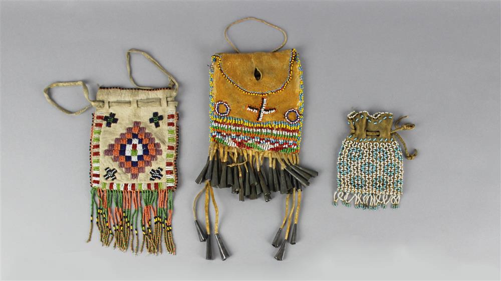 Appraisal: THREE SOUTHWESTERN BEADED HIDE BELT POUCHES APACHE h w in