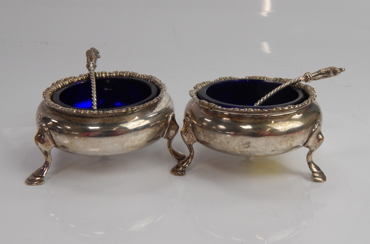 Appraisal: A pair of George III silver circular salts with gadrooned