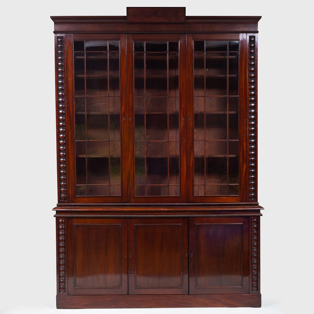 Appraisal: Late Regency Carved Mahogany Bookcase In two parts the upper