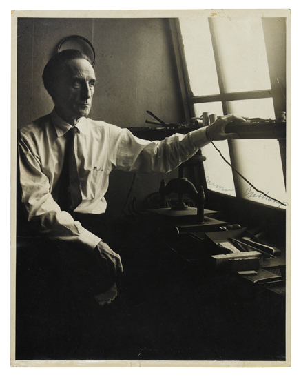 Appraisal: DUCHAMP MARCEL Photograph Signed image of him seated at a