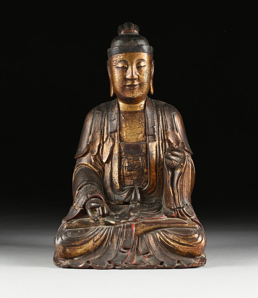 Appraisal: AN ANTIQUE CHINESE PARCEL GILT AND CARVED WOOD FIGURE OF