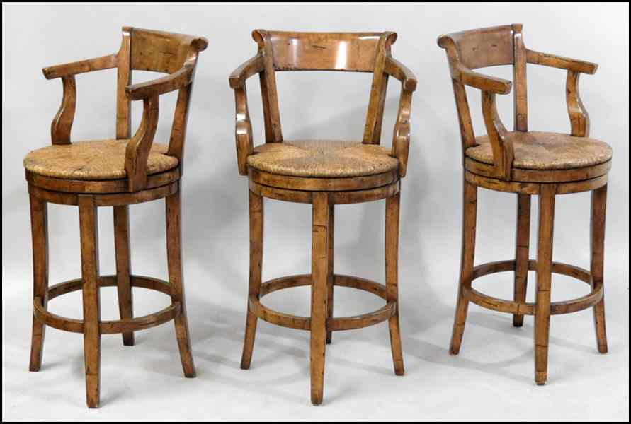 Appraisal: SET OF THREE CONTEMPORARY BAR STOOLS With swiveling rush seats