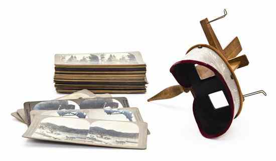 Appraisal: A Stereoscopic Viewer together with an assortment of cards Length