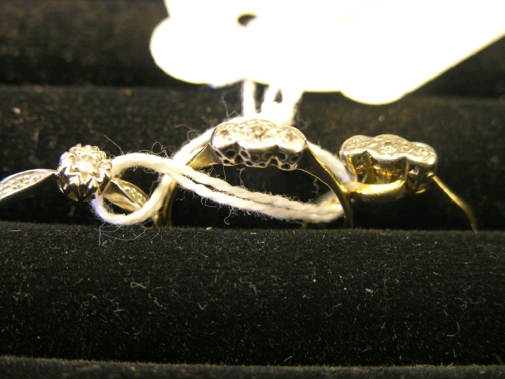 Appraisal: Two ct three-stone diamond half-hoop rings and a ct gold