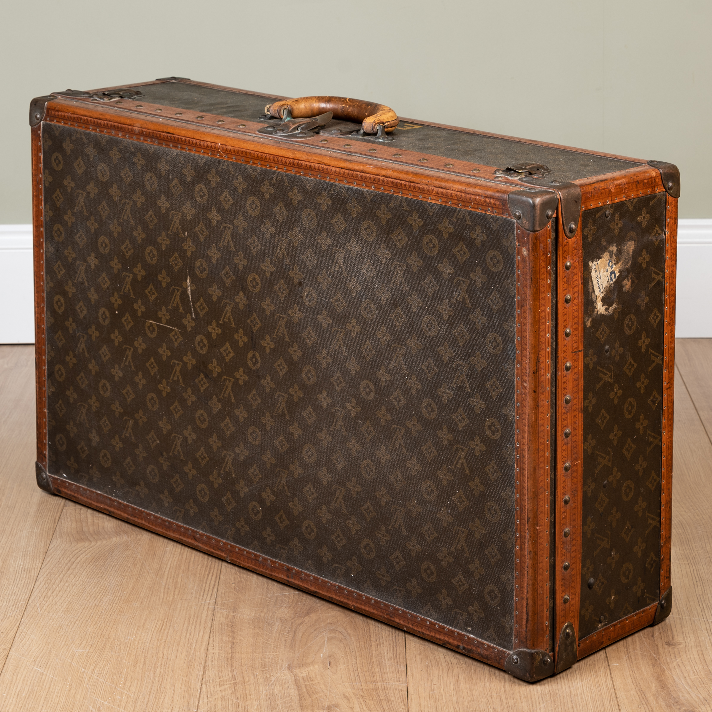 Appraisal: A vintage Louis Vuitton suitcase early th century with leather