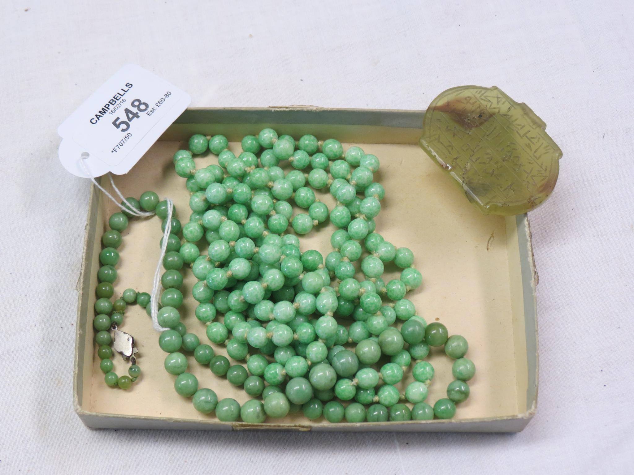 Appraisal: Two jade bead necklaces and a green-stone amulet with incised