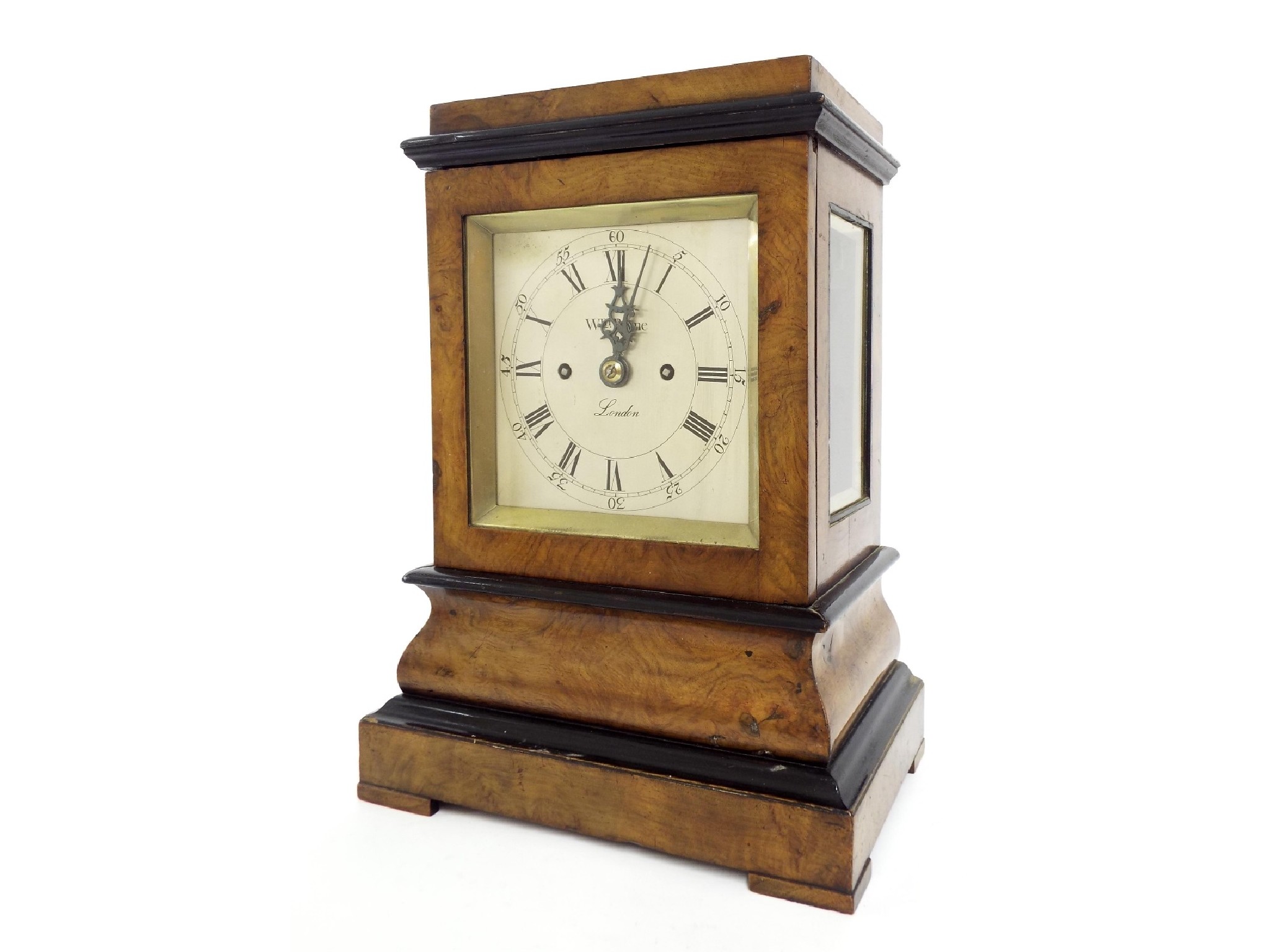 Appraisal: English walnut and ebonised double fusee library clock the square