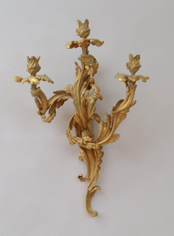 Appraisal: LOUIS XV STYLE GILT-BRONZE THREE-LIGHT WALL SCONCE The tiered foliate