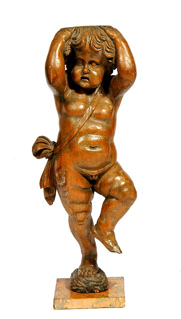 Appraisal: AN ANTIQUE CARVED PINE FIGURE OF A CARYATID PUTTO with