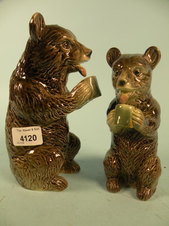 Appraisal: Two Continental Majolica bears each with a cup