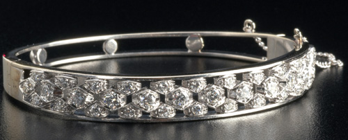 Appraisal: Diamond hinged bracelet in pt and k wg The central