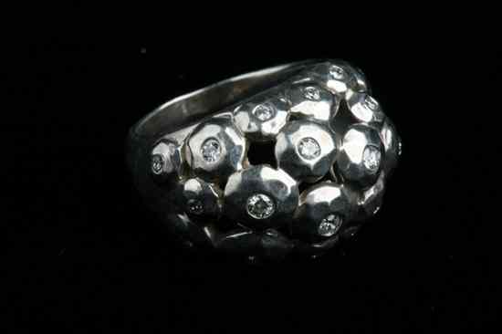 Appraisal: STERLING SILVER AND DIAMOND CONTEMPORARY DESIGN OPENWORK DOME RING brilliant