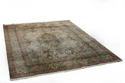 Appraisal: A Kashmiri silk rug the foliate scrolling design on a