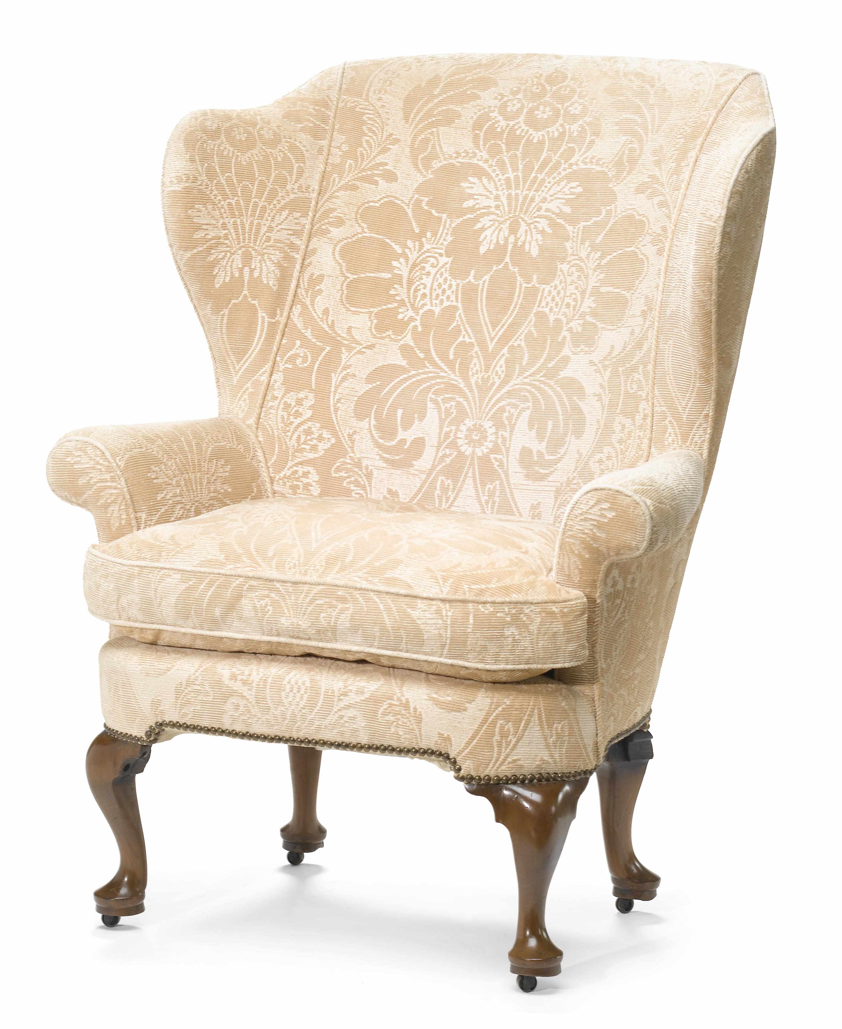 Appraisal: A George II style walnut framed wing armchair th century