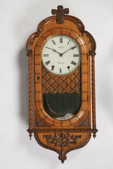 Appraisal: AN OAK CASED WALL CLOCK with a white painted dial