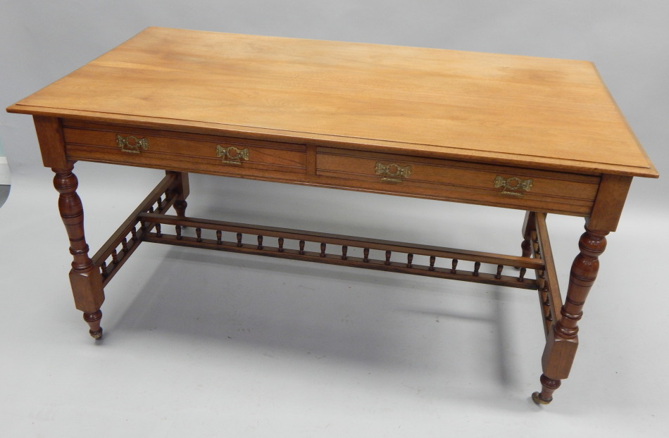 Appraisal: A Victorian walnut library table the rectangular top with a