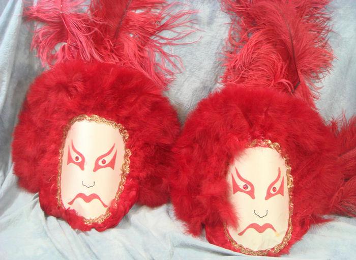 Appraisal: Mummers costume pair of Kabuki masks with red plumage Estimate