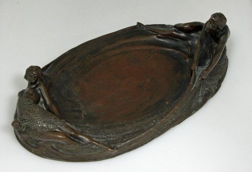 Appraisal: An Art Nouveau copper tray fisherman and mermaid cm wide