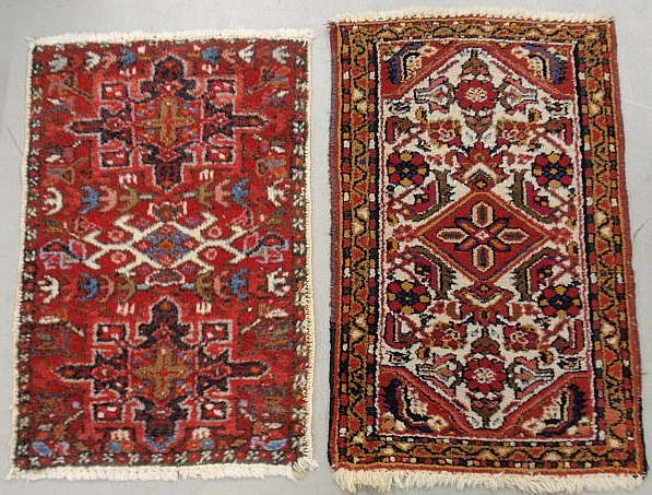 Appraisal: - Two Persian mats with red fields and floral patterns