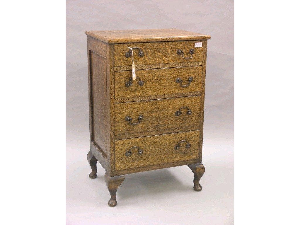 Appraisal: A small oak chest four drawers each with brass swan-neck