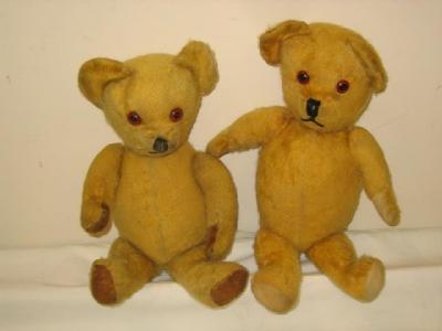 Appraisal: An English teddy bear flock filled with amber button eyes