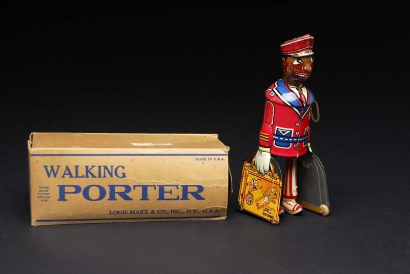 Appraisal: Tin Marx Walking Porter Wind-Up Toy Description American Working Minor