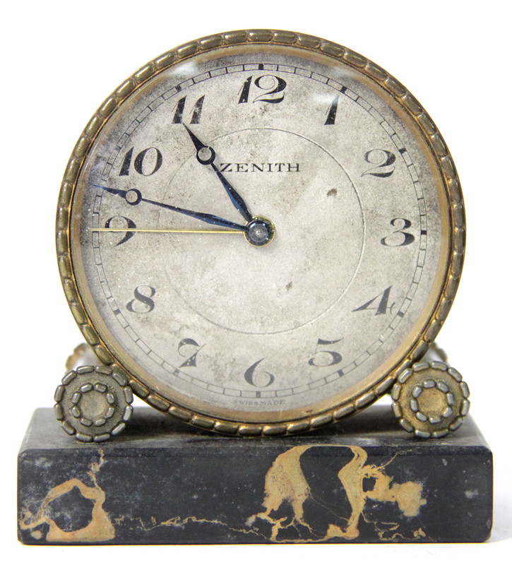 Appraisal: A small alarm clock the circular silvered dial with Arabic