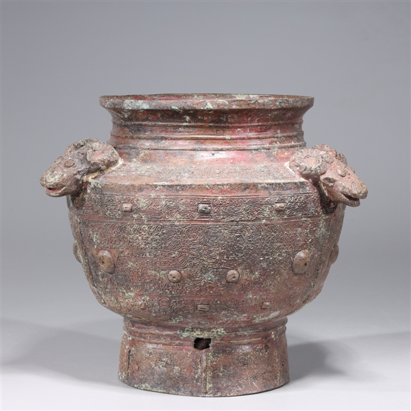 Appraisal: Chinese archaistic bronze vessel with molded ram head handles intricate