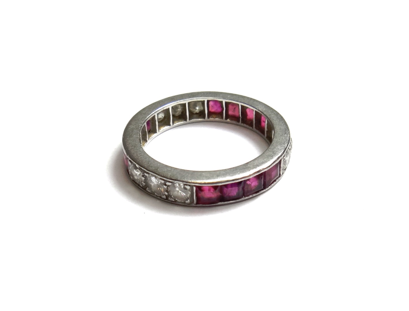 Appraisal: A ruby and diamond set full eternity ring mounted with