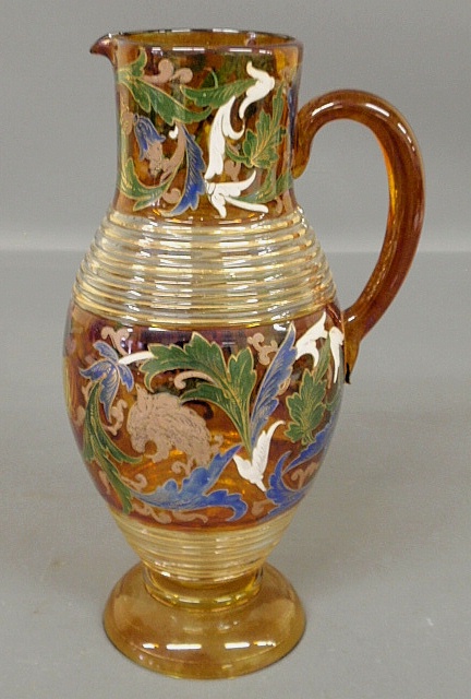 Appraisal: - German amber glass pitcher c decorated with colorful figures