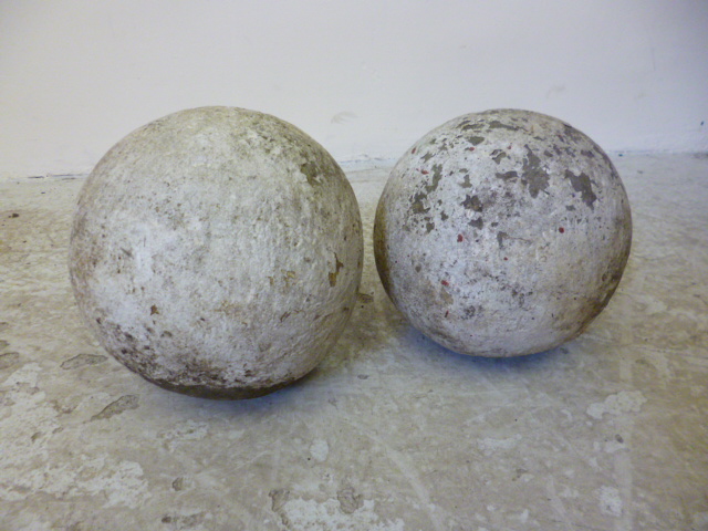 Appraisal: TWO SIMILAR LIME STONE SPHERES high Illustrated