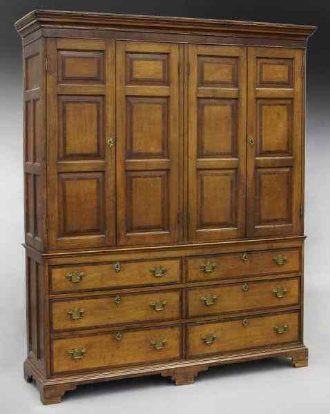 Appraisal: Oak housekeeper's cupboard on six drawer basethe top section with