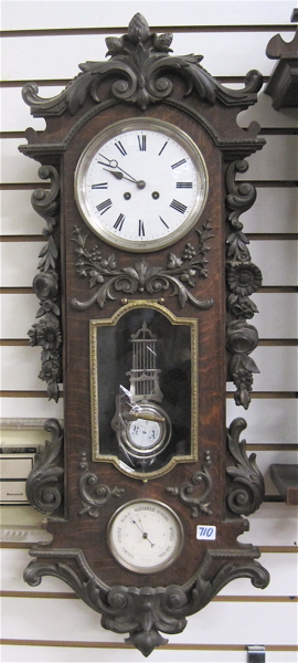 Appraisal: AN OAK AND CAST IRON WALL CLOCK BAROMETER French c