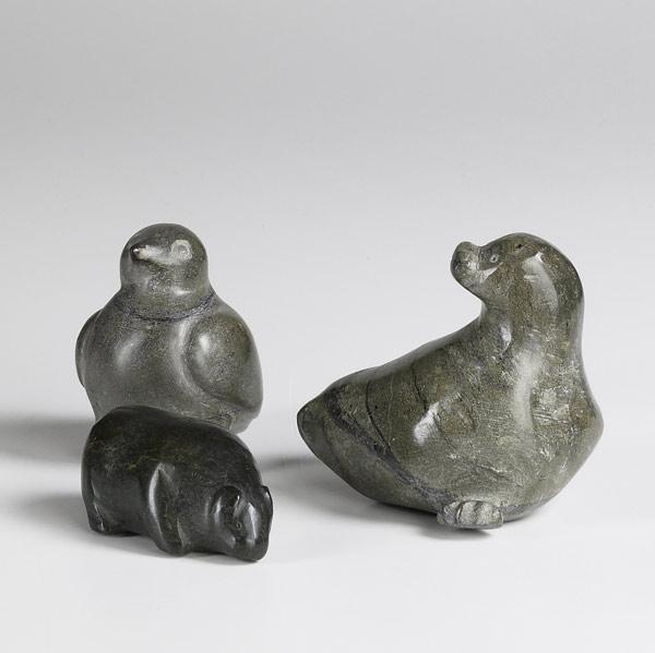 Appraisal: INUIT GREEN SOAPSTONE ANIMAL CARVINGS A seal a bear and