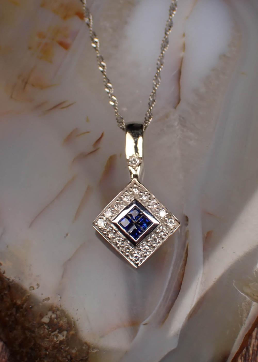 Appraisal: DIAMOND SAPPHIRE AND WHITE GOLD PENDANT NECKLACE with a Italian