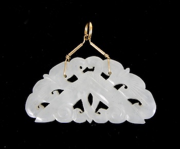 Appraisal: A Carved White Jade Pendant Chinese Stylized reticulated carving in