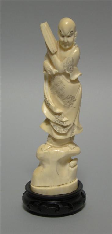 Appraisal: JAPANESE IVORY FIGURE Carved as a robed figure of an