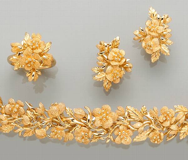 Appraisal: A suite of fourteen karat gold floral motif jewelry comprising