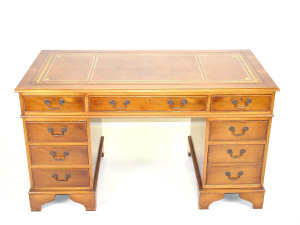 Appraisal: A Reproduction mahogany pedestal desk the leather inset top above