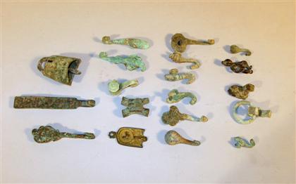 Appraisal: Group of nineteen small archaic Chinese bronzes Han dynasty and