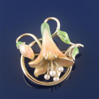 Appraisal: A gold brooch modelled as a lily decorated with translucent