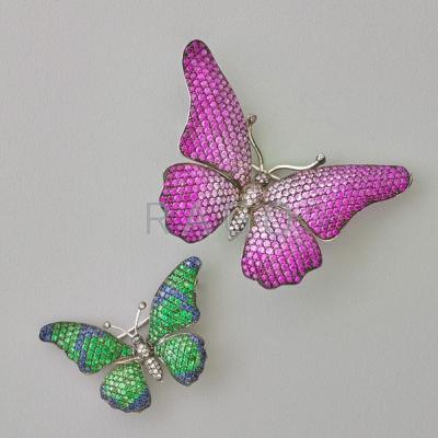 Appraisal: TWO JEWELED BUTTERFLY BROOCHES Shaded pink sapphires weighing cts on