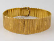 Appraisal: A yellow metal tests carat gold tapered bracelet with engraved