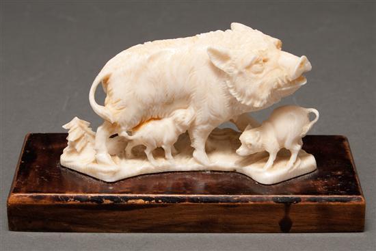 Appraisal: Continental carved ivory figural group of a wild boar with