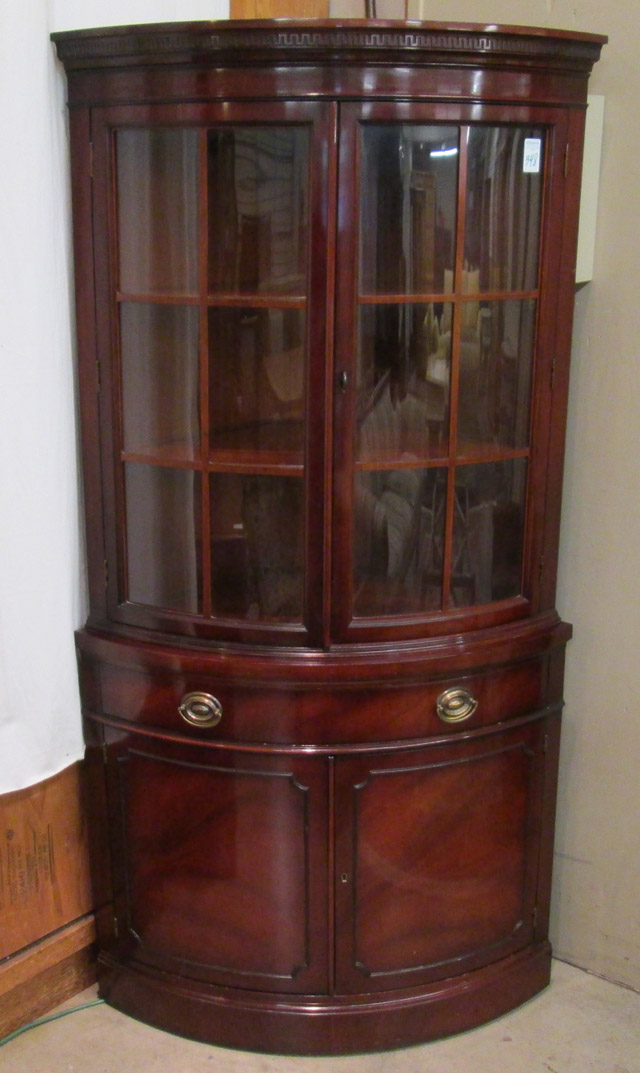 Appraisal: FEDERAL STYLE MAHOGANY BOW-FRONT CORNER CABINET Drexel Furniture Co mid-