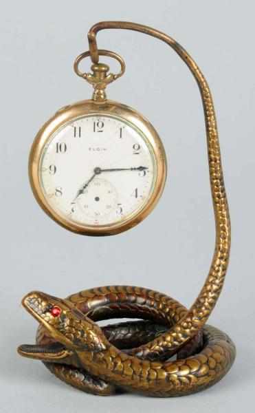 Appraisal: Brass Figural Snake Watch Holder Fantastic detail with ruby red